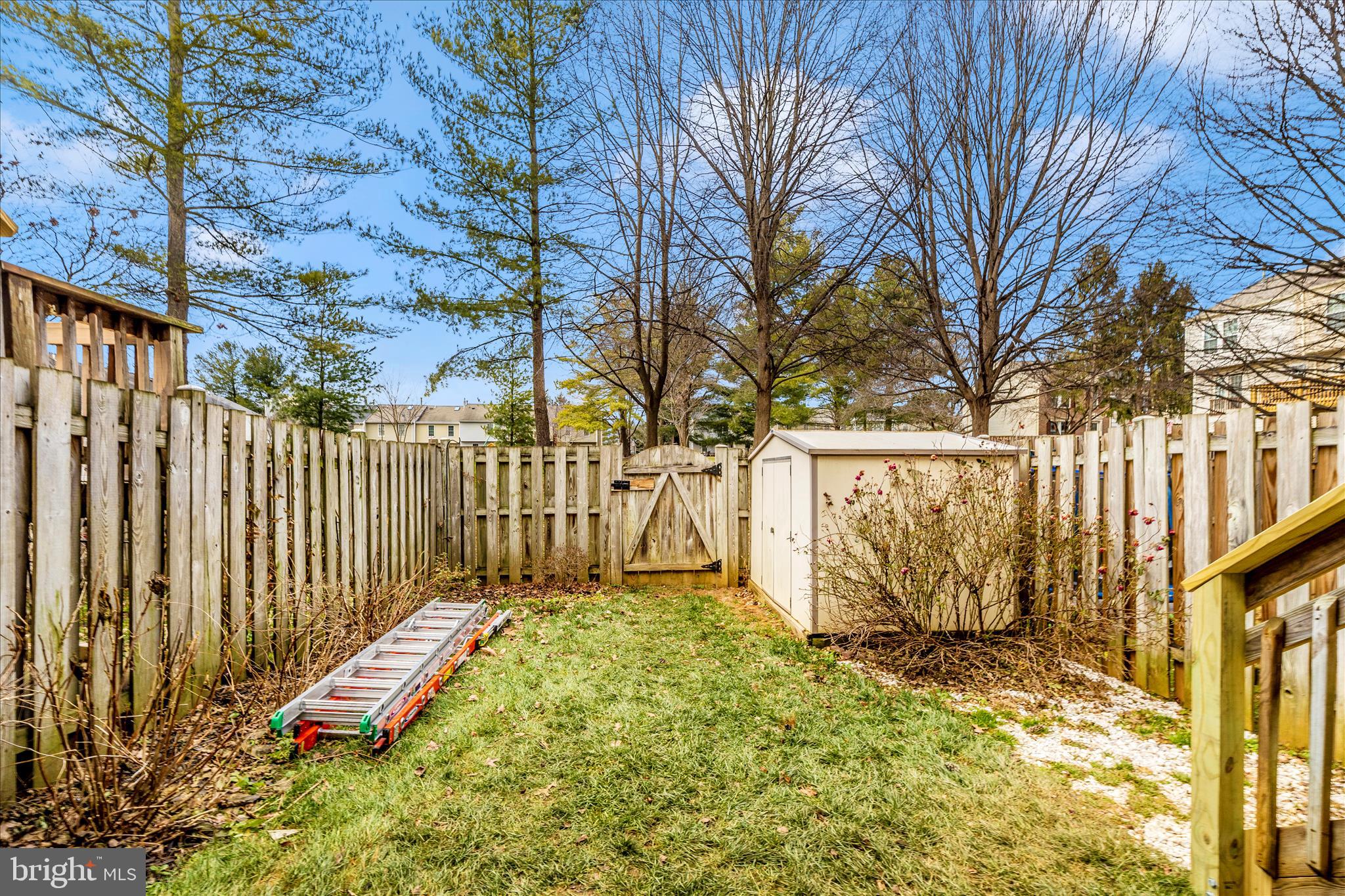 1511 Beverly Court Frederick, MD 21701 - Photo 44 of 72 a view of a backyard with wooden fence and a bench