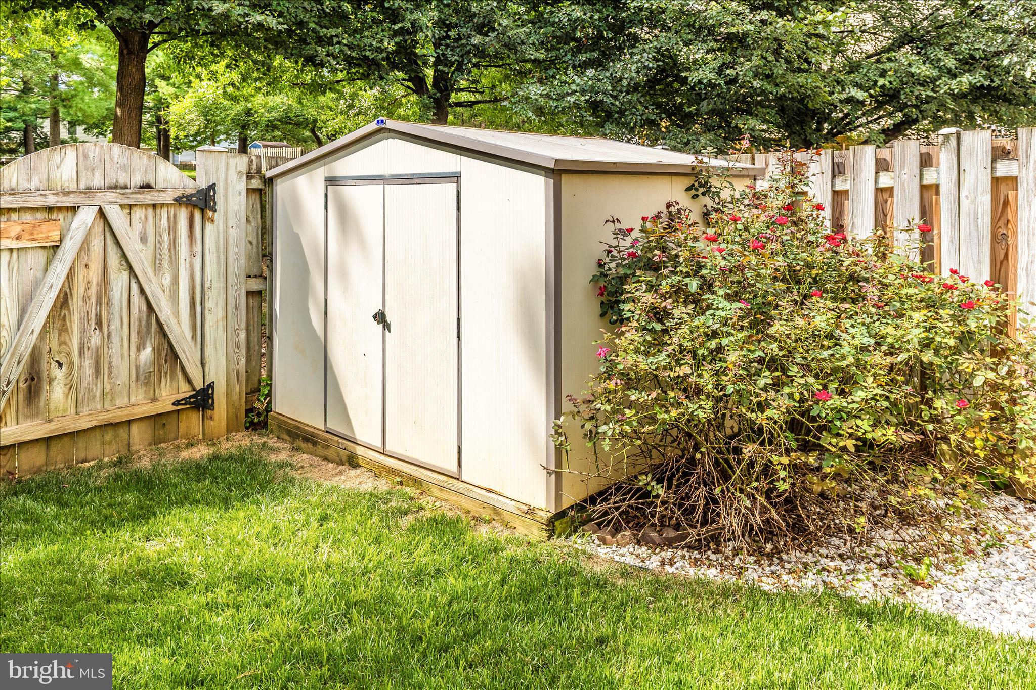 1511 Beverly Court Frederick, MD 21701 - Photo 45 of 72 a front view of a house with a yard and fountain