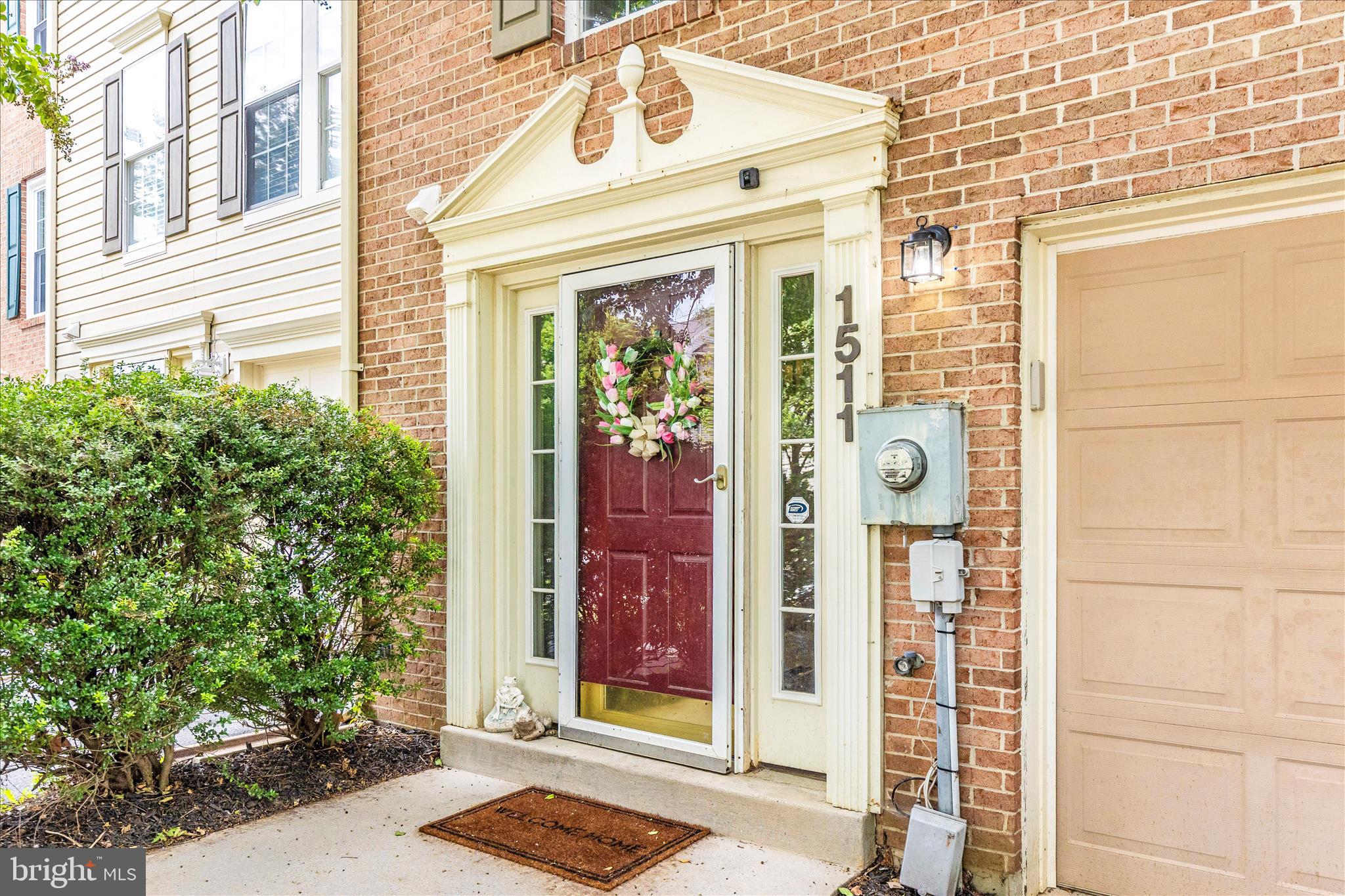 1511 Beverly Court Frederick, MD 21701 - Photo 55 of 72 a front view of a building with a potted plant windows