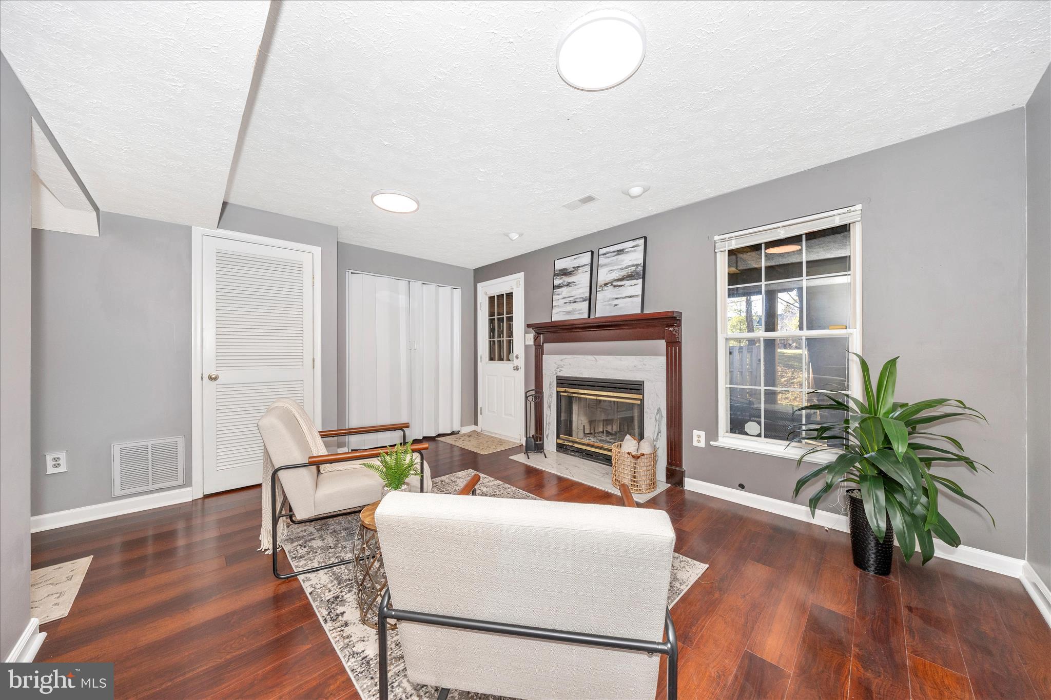 1511 Beverly Court Frederick, MD 21701 - Photo 6 of 72 a living room with furniture and a fireplace