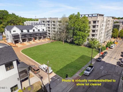 a view of a building with a lot of trees in front of it