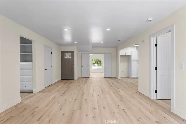 wooden floor with white walls
