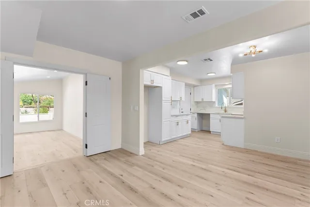 a view of kitchen and wooden floor