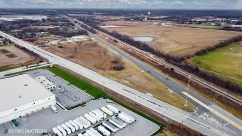 a view of swimming pool with a chair