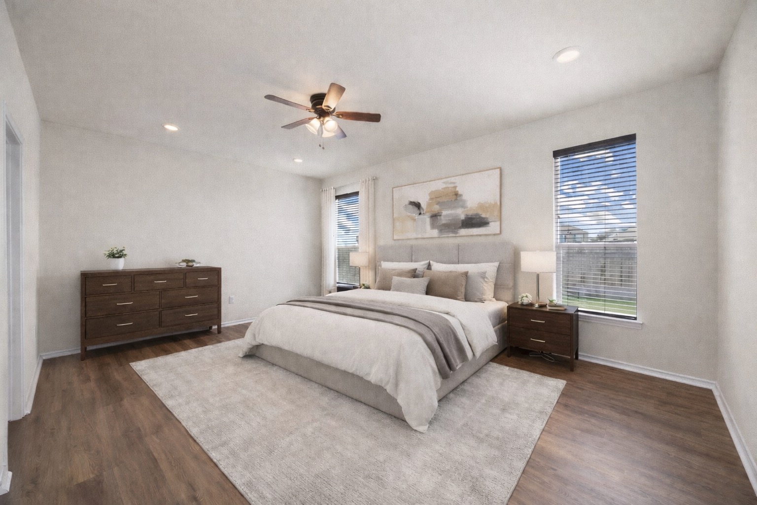 136 Vickers Street Georgetown, TX 78628 - Photo 14 of 33 a large bedroom with a bed dresser and wooden floor