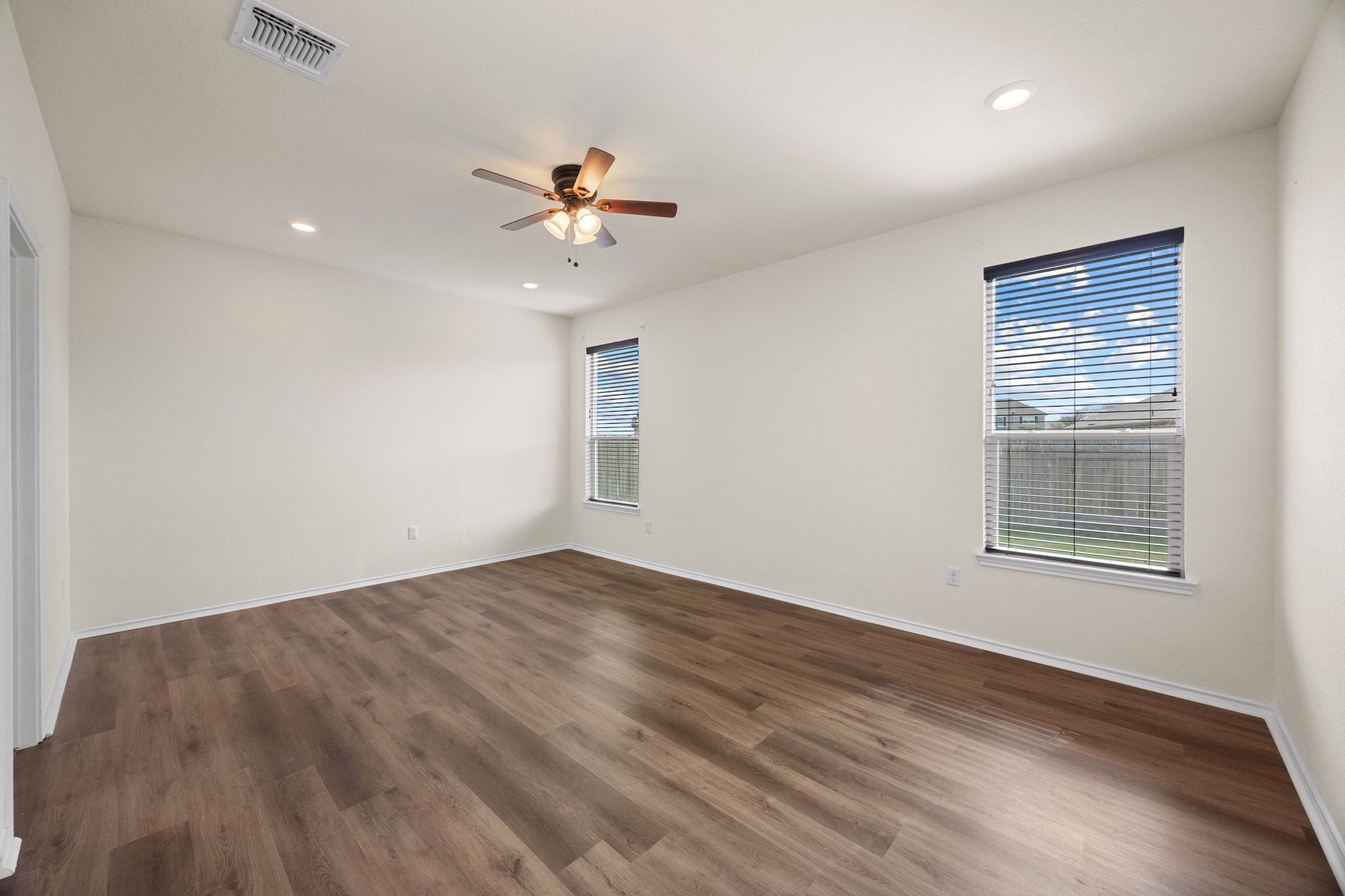 136 Vickers Street Georgetown, TX 78628 - Photo 15 of 33 wooden floor in an empty room with a window