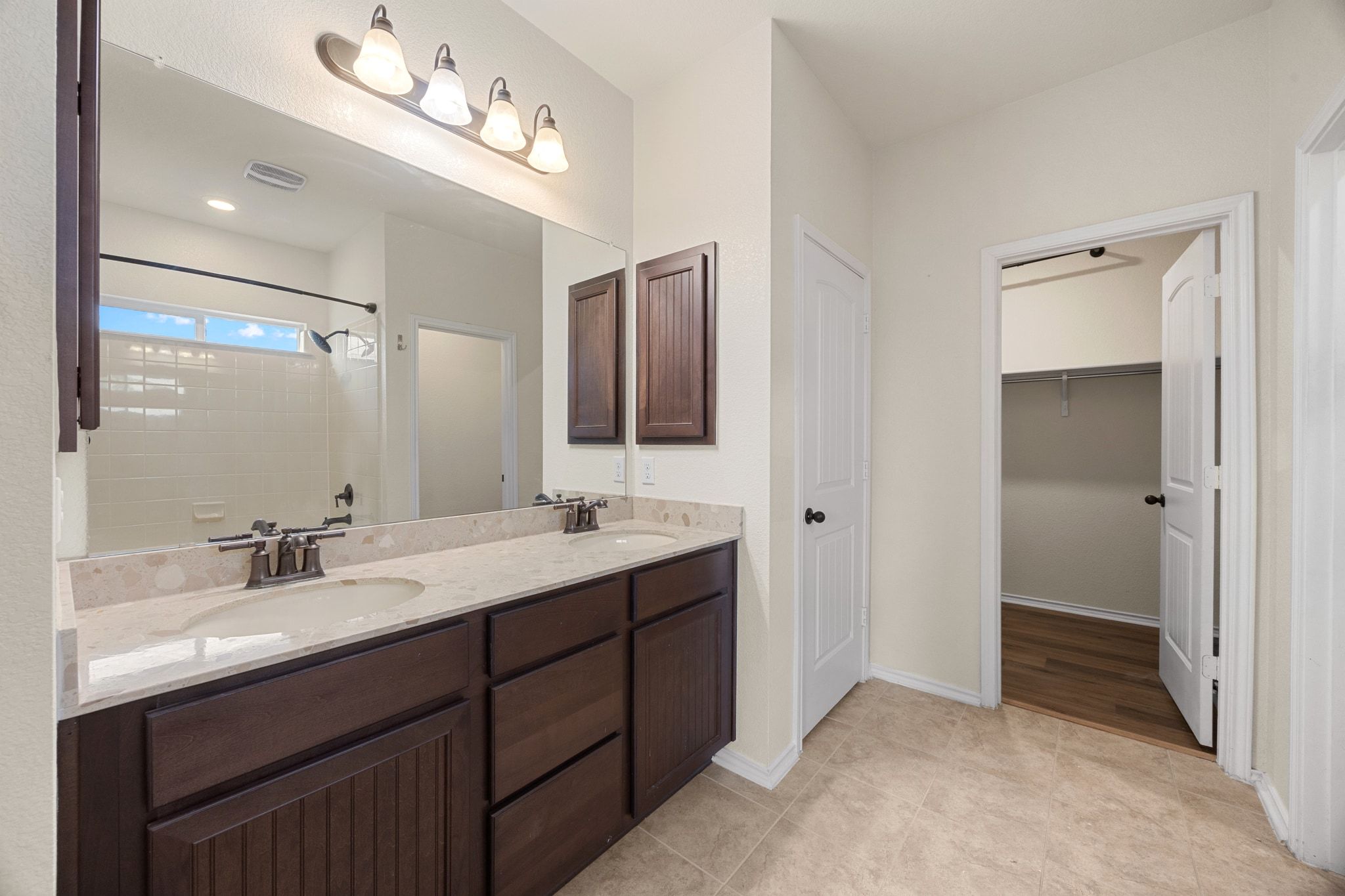 136 Vickers Street Georgetown, TX 78628 - Photo 18 of 33 a bathroom with double sink and a mirror