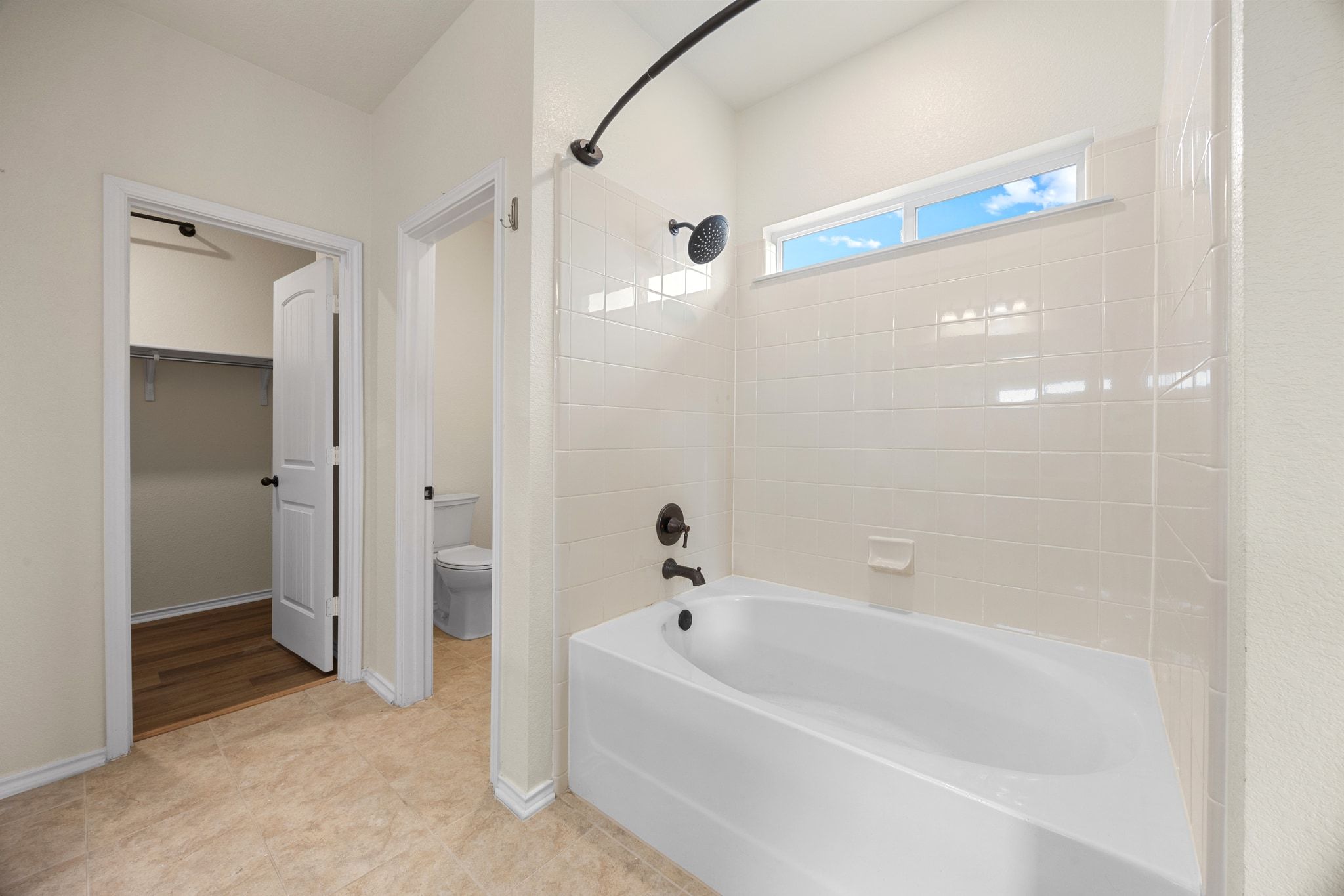 136 Vickers Street Georgetown, TX 78628 - Photo 19 of 33 a white bath tub sitting next to a shower