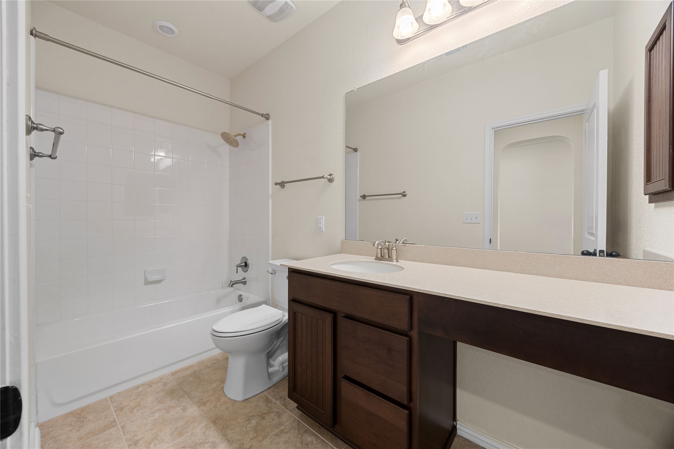 136 Vickers Street Georgetown, TX 78628 - Photo 22 of 33 a bathroom with a double vanity sink toilet and shower