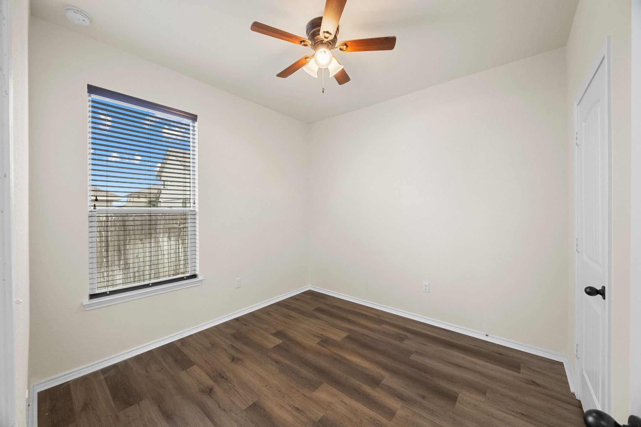 136 Vickers Street Georgetown, TX 78628 - Photo 23 of 33 an empty room with a window and a ceiling fan