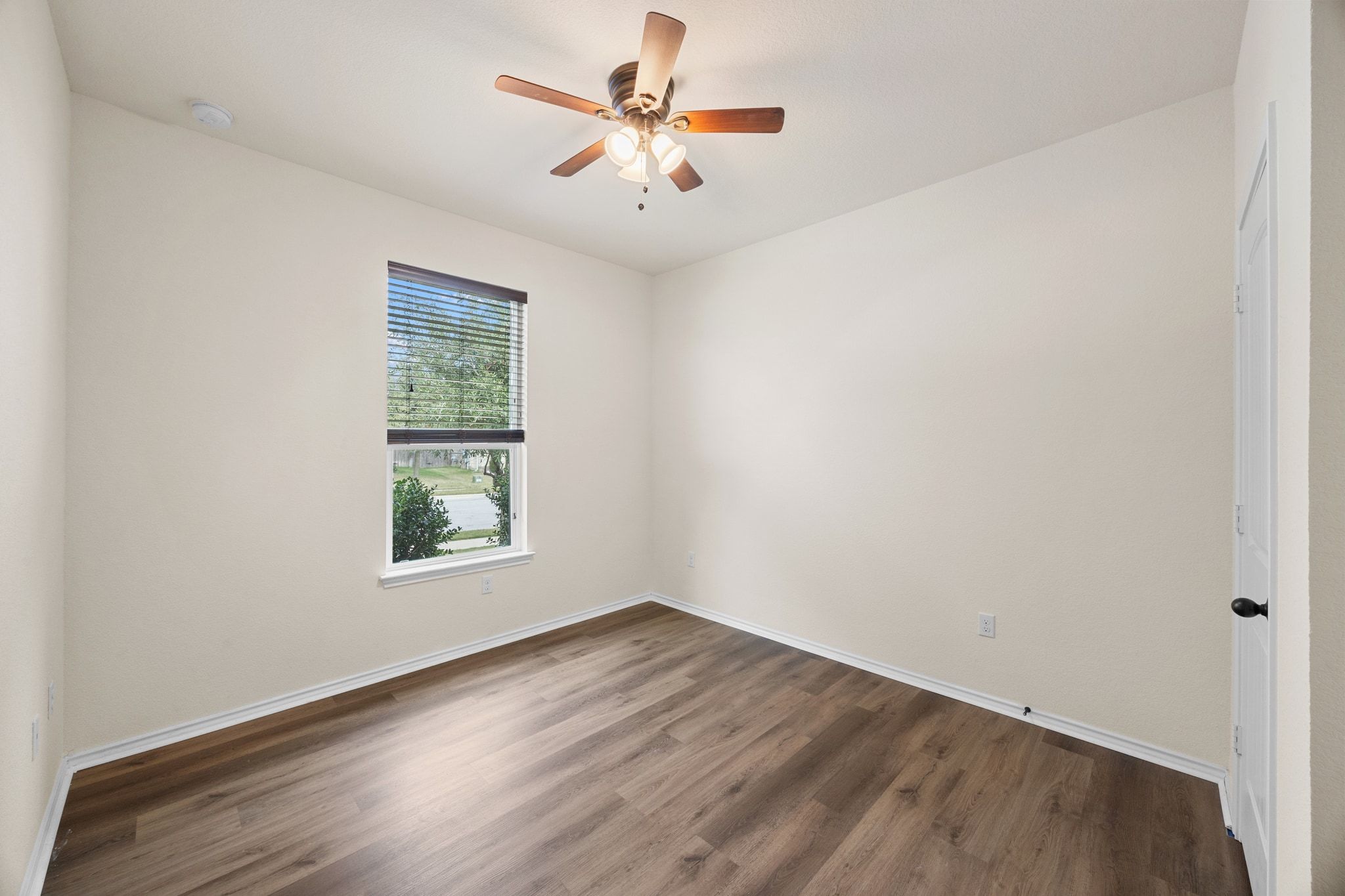136 Vickers Street Georgetown, TX 78628 - Photo 25 of 33 an empty room with a window and a fan