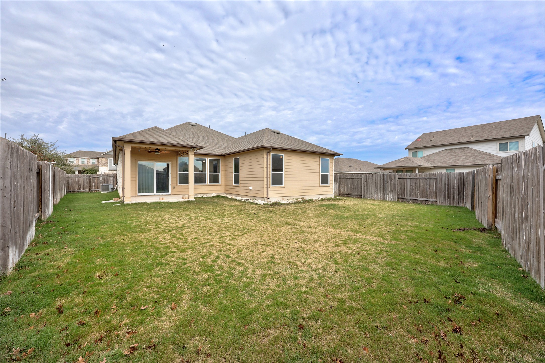 136 Vickers Street Georgetown, TX 78628 - Photo 27 of 33 a view of a house with a backyard