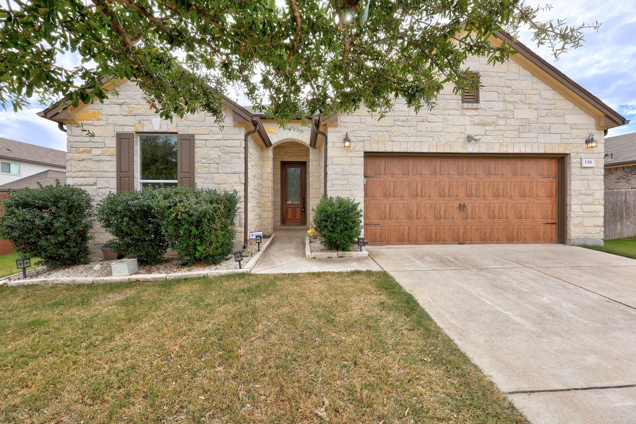 136 Vickers Street Georgetown, TX 78628 - Photo 3 of 33 a front view of a house with a yard and garage
