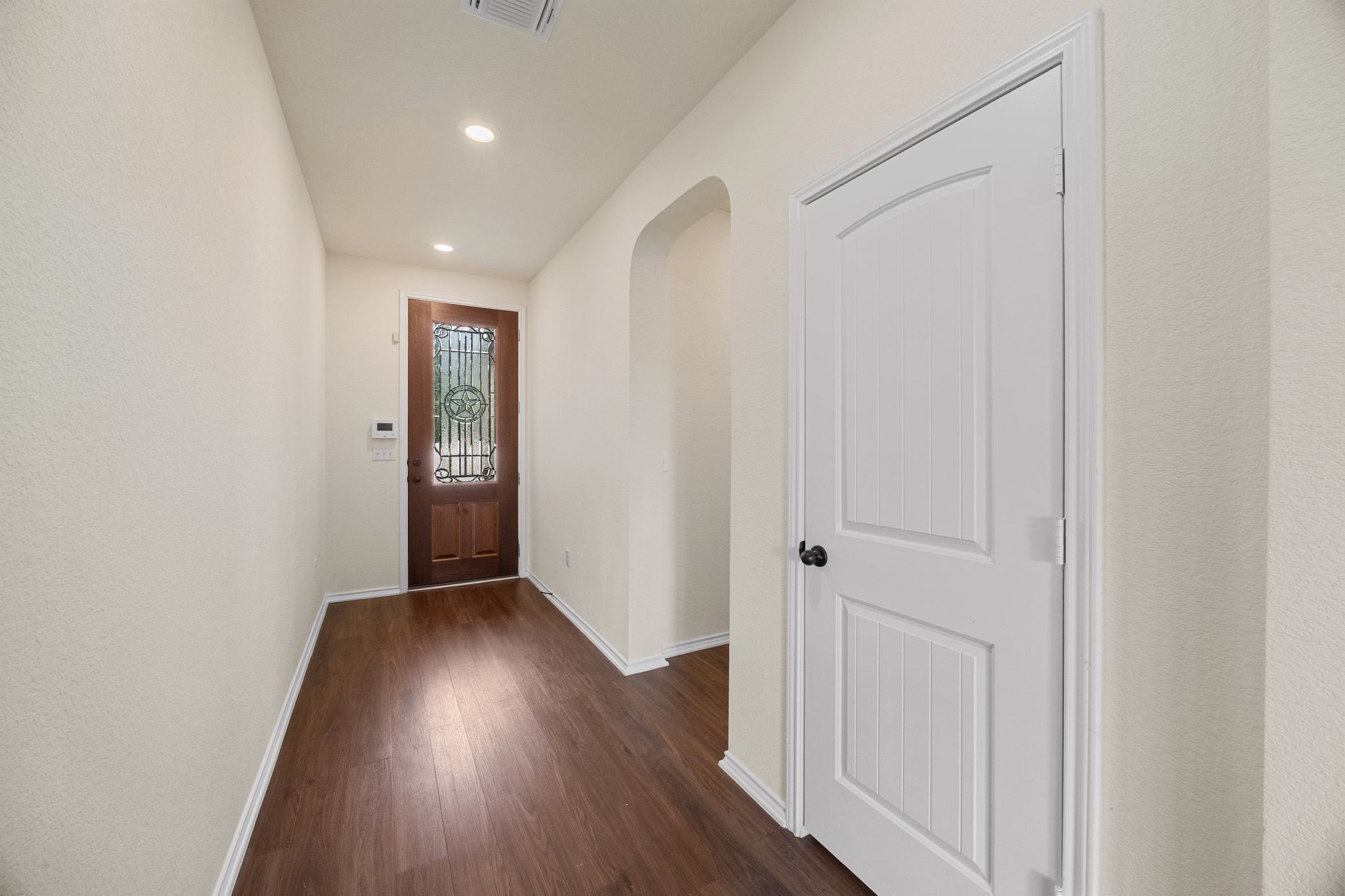 136 Vickers Street Georgetown, TX 78628 - Photo 5 of 33 an empty room with wooden floor and closet
