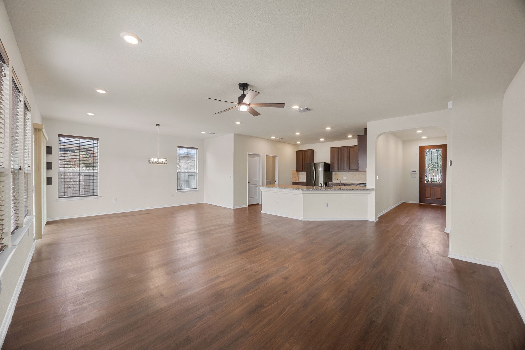 136 Vickers Street Georgetown, TX 78628 - Photo 8 of 33 a view of a kitchen with a sink and a refrigerator