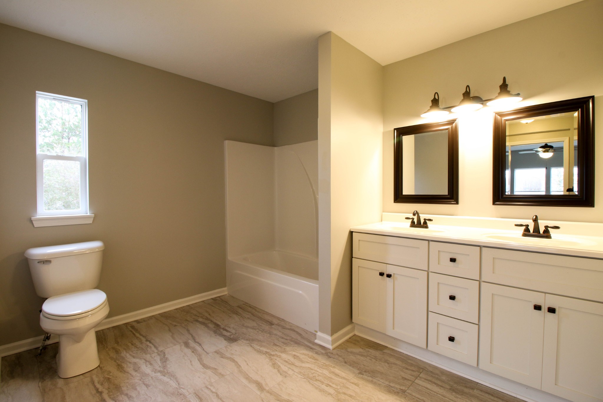 4413 Woodrow Wilson Road Springfield, TN 37172 - Photo 13 of 19 a bathroom with a toilet sink and mirror