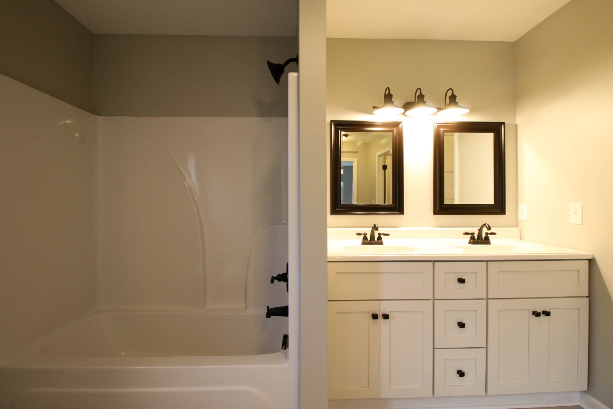 4413 Woodrow Wilson Road Springfield, TN 37172 - Photo 14 of 19 a bathroom with a double vanity sink and a mirror