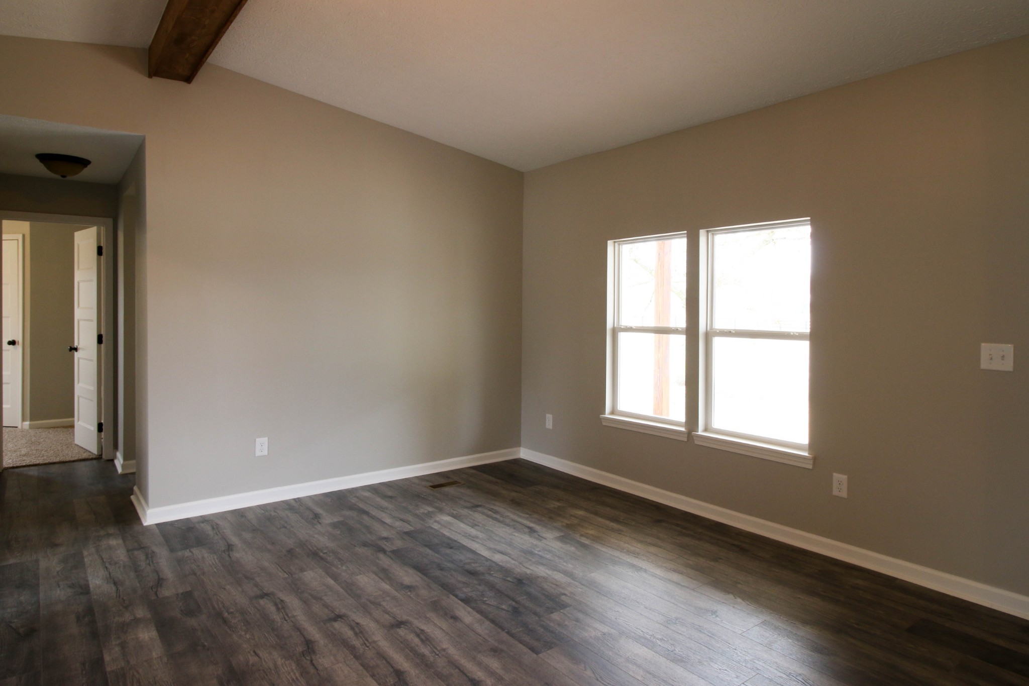 4413 Woodrow Wilson Road Springfield, TN 37172 - Photo 7 of 19 an empty room with wooden floor and windows