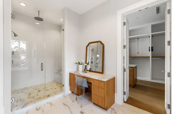 a bedroom with a bed and a view of bathroom