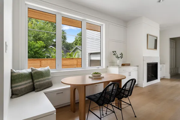 a dining room with furniture window and outside view