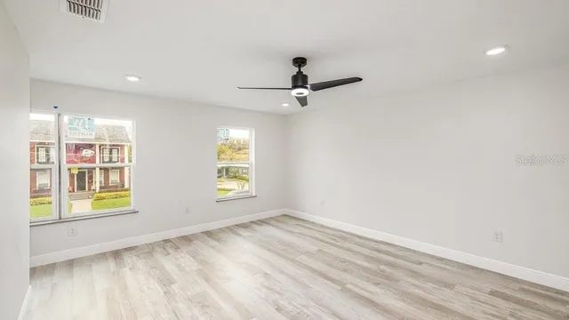 a view of an empty room with a window