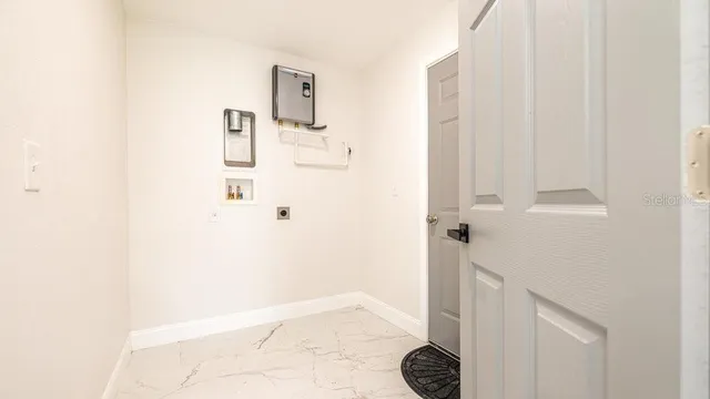 a view of a hallway with windows and stairs