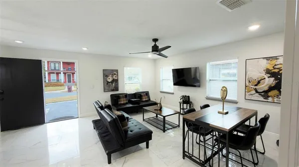 a living room with furniture and a flat screen tv