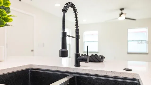 a kitchen with a sink and a window