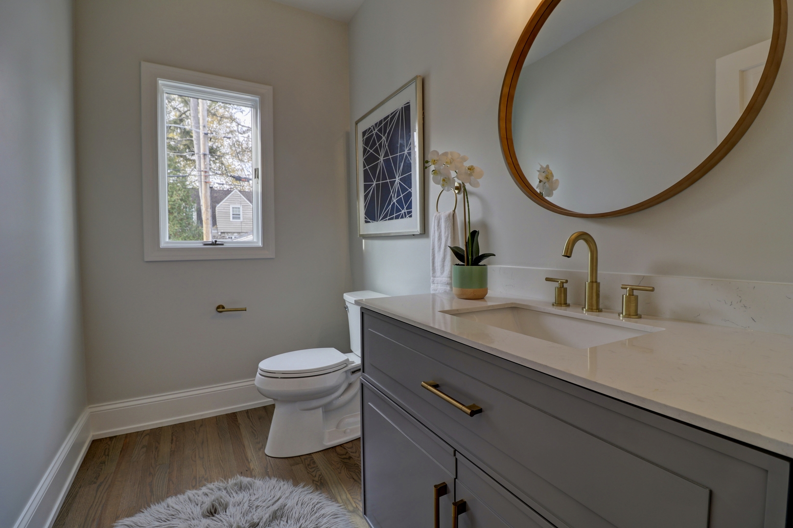 3910 Wolf Road Western Springs, IL 60558 - Photo 20 of 36 a bathroom with a toilet a sink and mirror