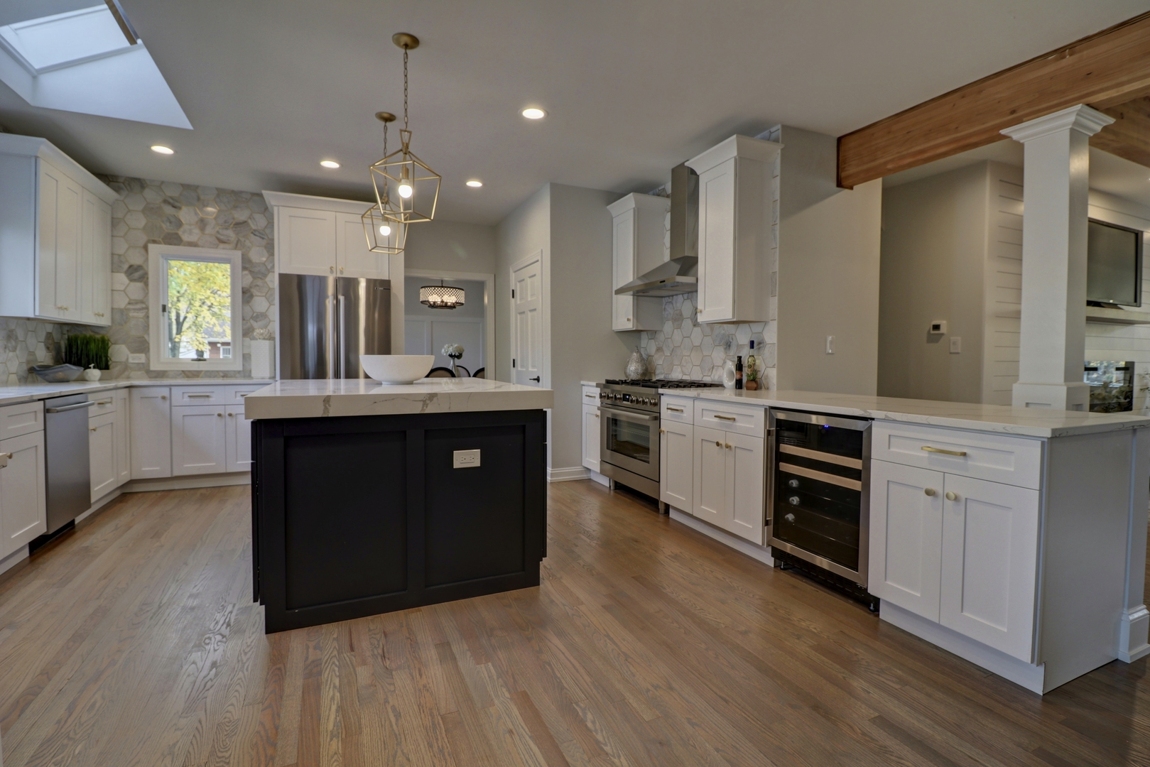 3910 Wolf Road Western Springs, IL 60558 - Photo 3 of 36 a kitchen with stainless steel appliances kitchen island granite countertop a stove a sink a refrigerator and a oven