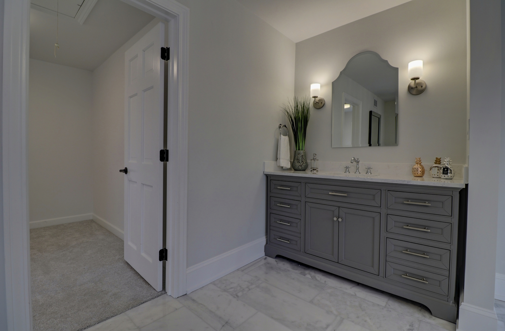 3910 Wolf Road Western Springs, IL 60558 - Photo 25 of 36 a bathroom with a double vanity sink and a mirror