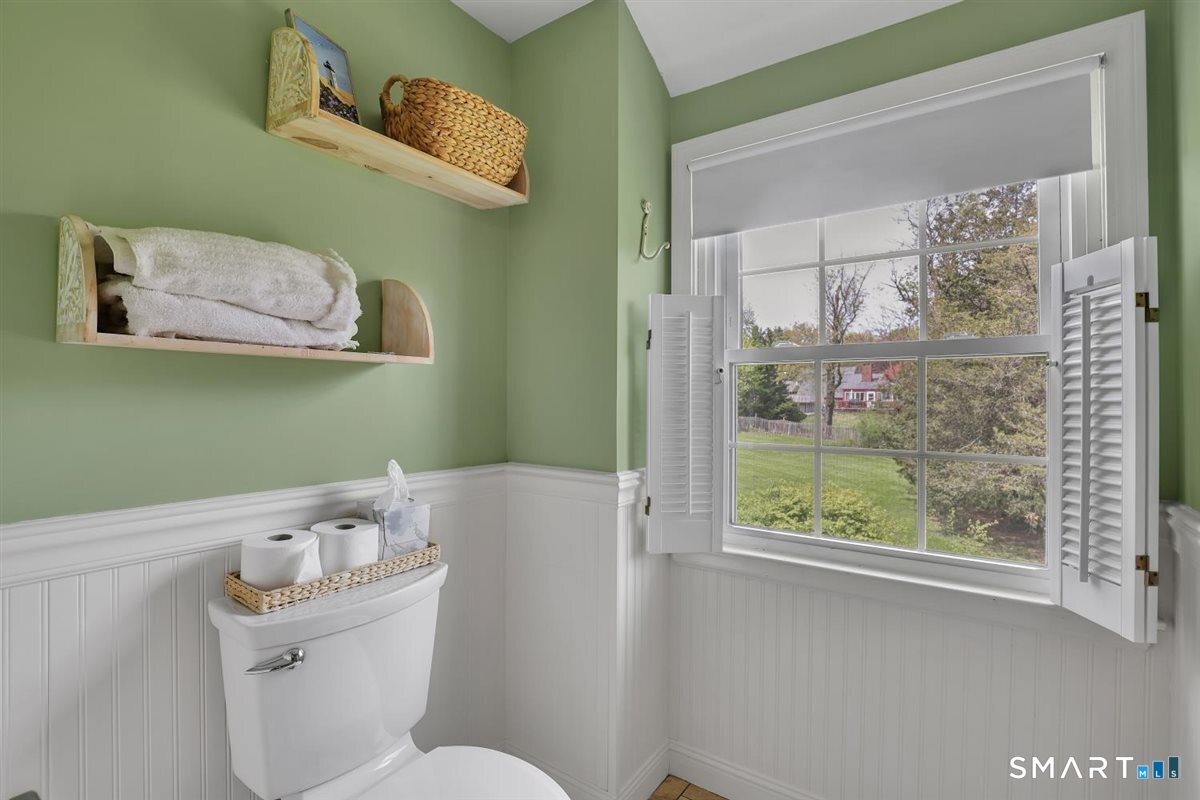 72 Old Post Road Wethersfield, CT 06109 - Photo 20 of 40 a bathroom with a toilet sink and mirror