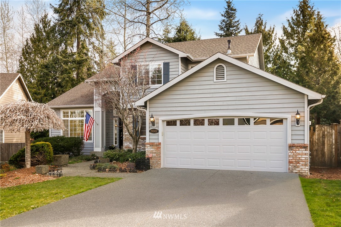 19907 29th Drive Southeast Bothell, WA 98012 - Photo 2 of 25 a view of house along with yard and trees in the background