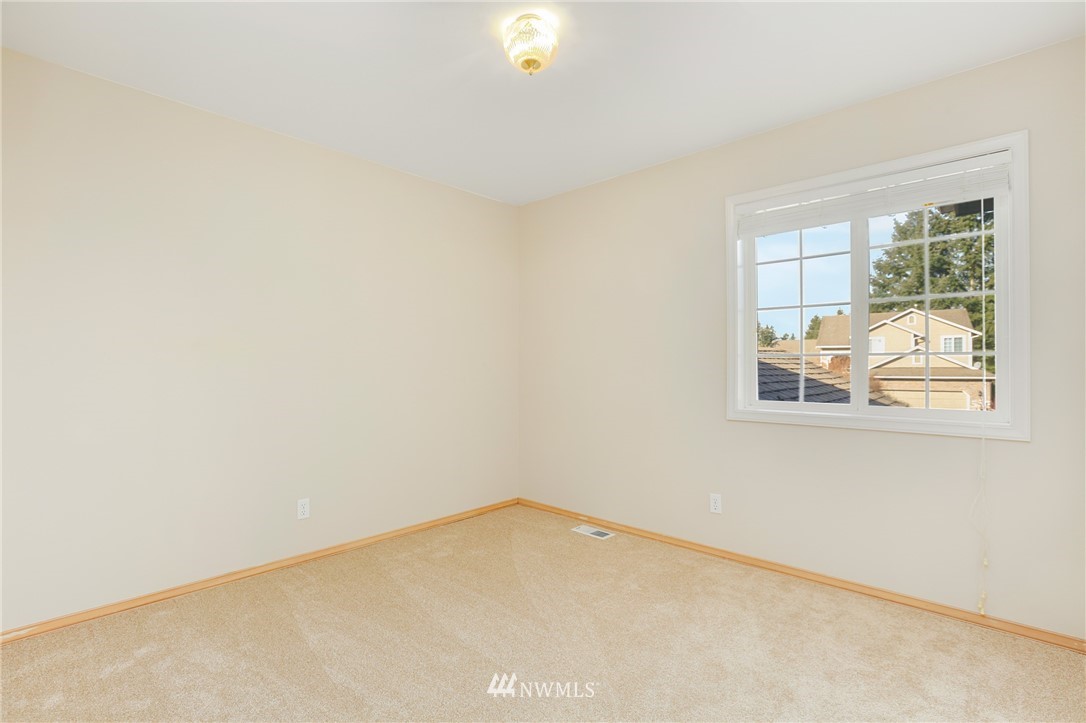 19907 29th Drive Southeast Bothell, WA 98012 - Photo 15 of 25 a view of an empty room with a window
