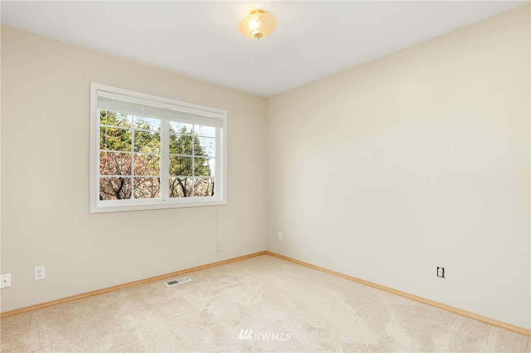 19907 29th Drive Southeast Bothell, WA 98012 - Photo 16 of 25 an empty room with a window