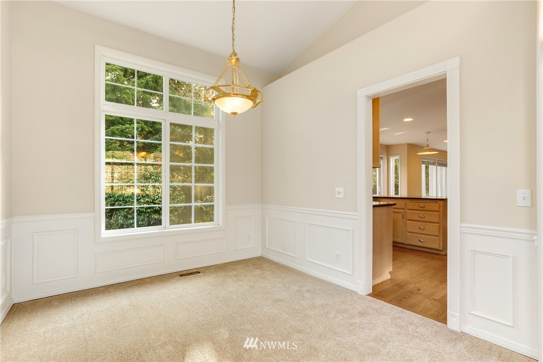 19907 29th Drive Southeast Bothell, WA 98012 - Photo 7 of 25 an empty room with a window and a kitchen