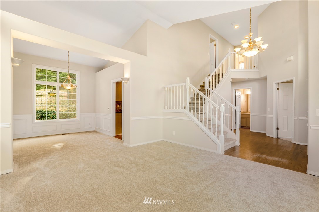 19907 29th Drive Southeast Bothell, WA 98012 - Photo 8 of 25 an empty room with chandelier fan and windows