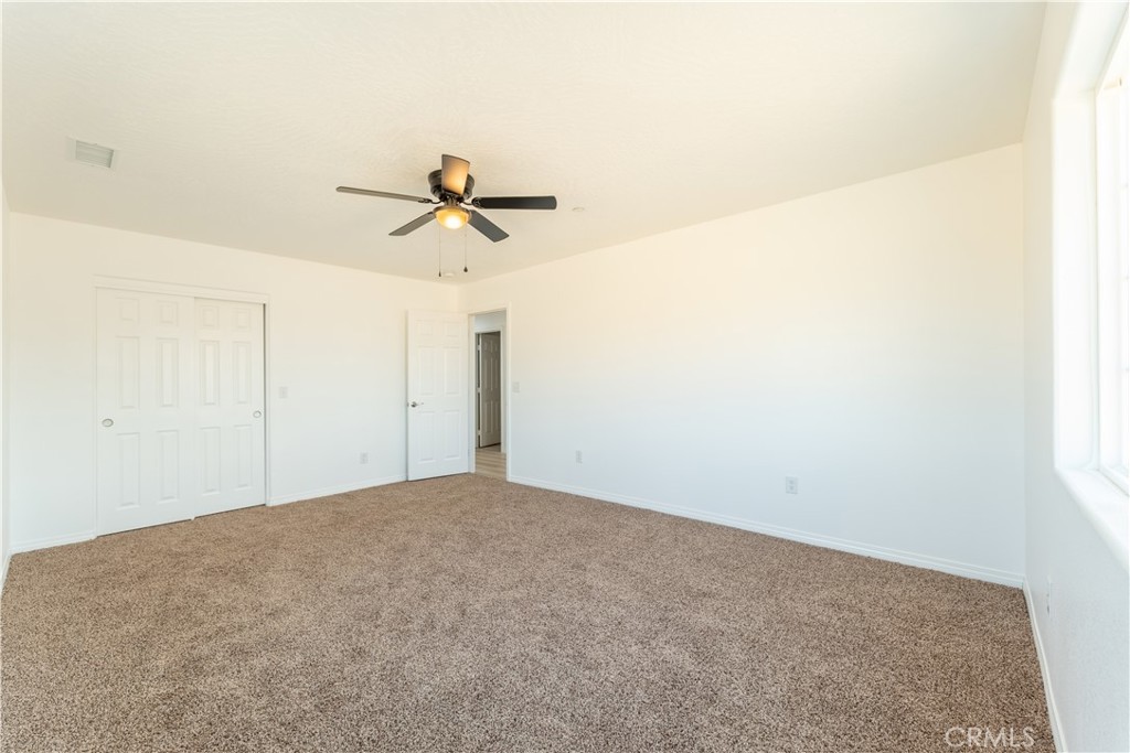 16925 Nanticoke Road Apple Valley, CA 92307 - Photo 77 of 87 a view of a big room with carpet