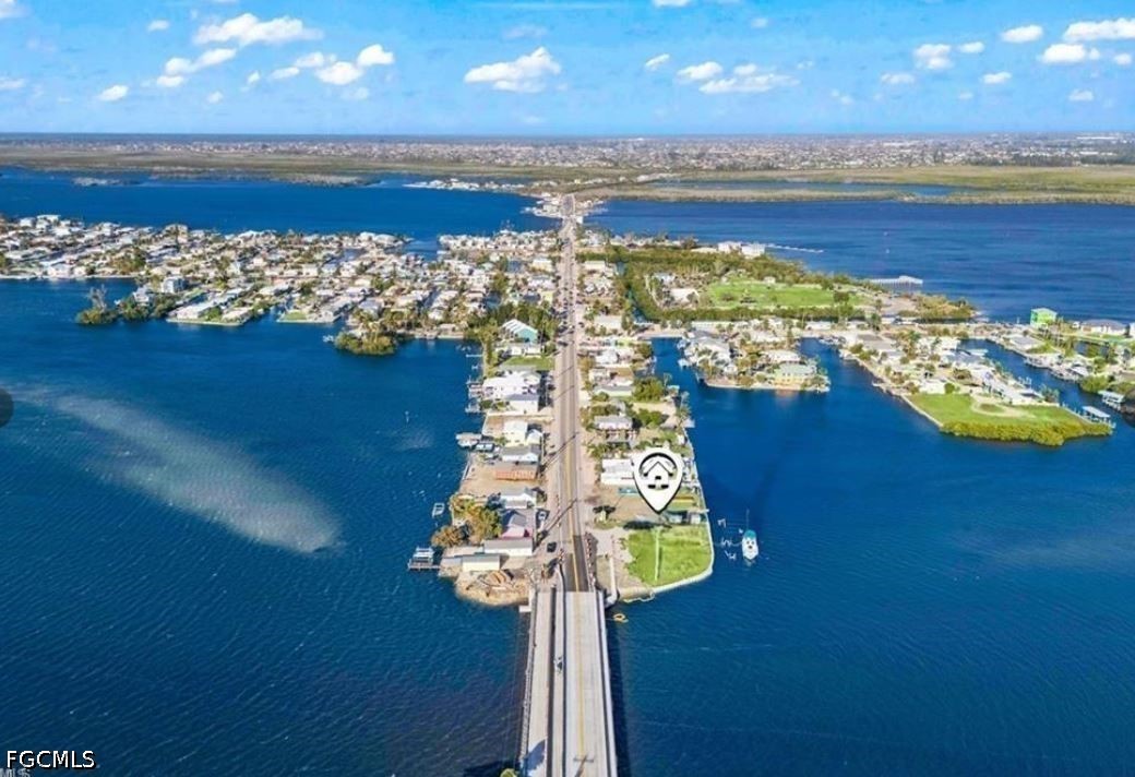 4767 Pine Island Road Matlacha, FL 33993 - Photo 2 of 12 a view of an ocean and a building in the background