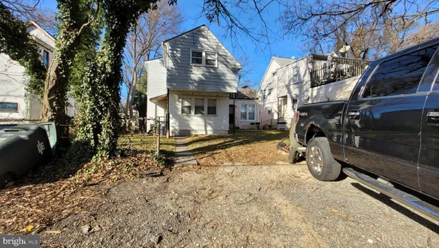 a backyard of a house with barbeque oven fire pit and outdoor seating