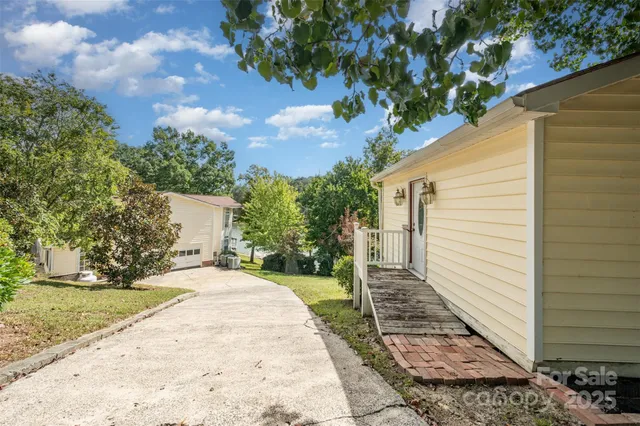 a view of a backyard with sitting area