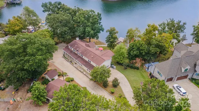an aerial view of a house with garden space and street view