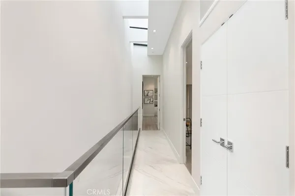 a view of a hallway with a white walls