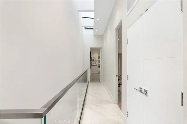 a view of a hallway with a white walls