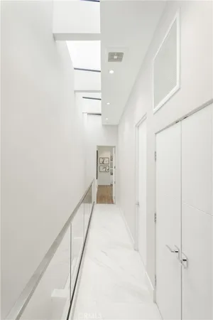 a view of a patio with table and chairs and potted plants