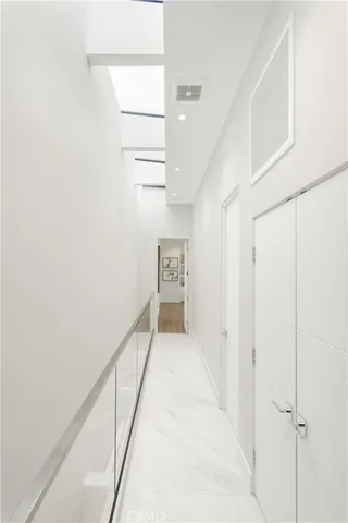 a view of a patio with table and chairs and potted plants