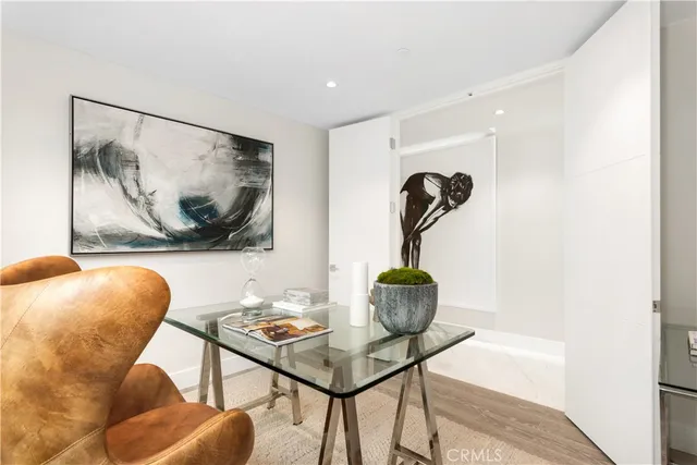 a bedroom with a large bed and a large window