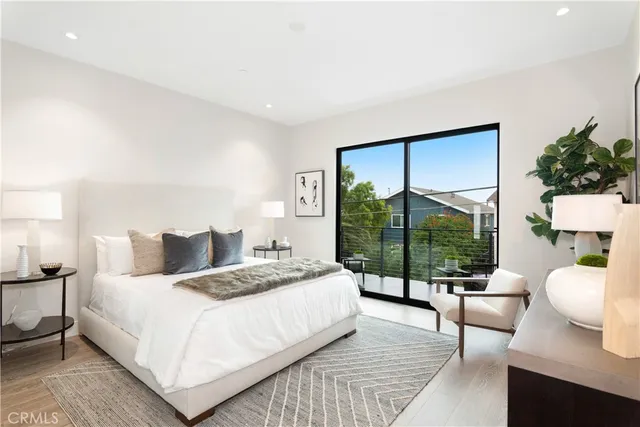 a bedroom with a bed and a table in it