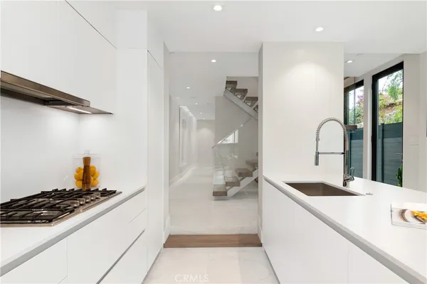 a backyard of a house with a yard and outdoor seating