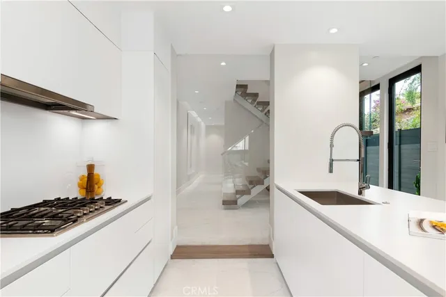 a backyard of a house with a yard and outdoor seating